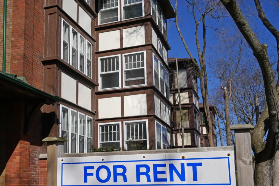 Brick apartment building with For Rent sign